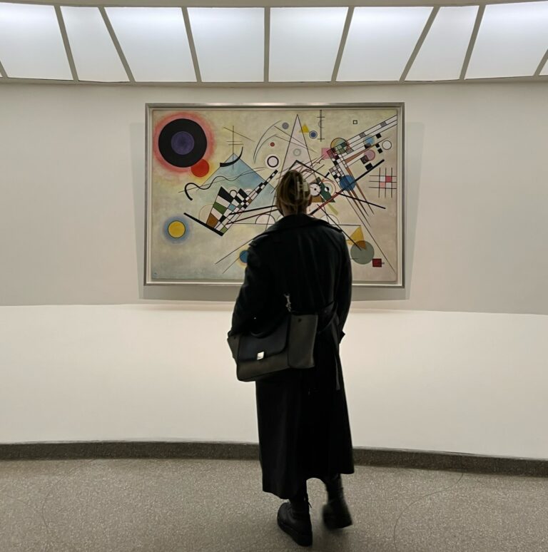 A woman observing Kandinsky painting. Photo by Micaela Preble