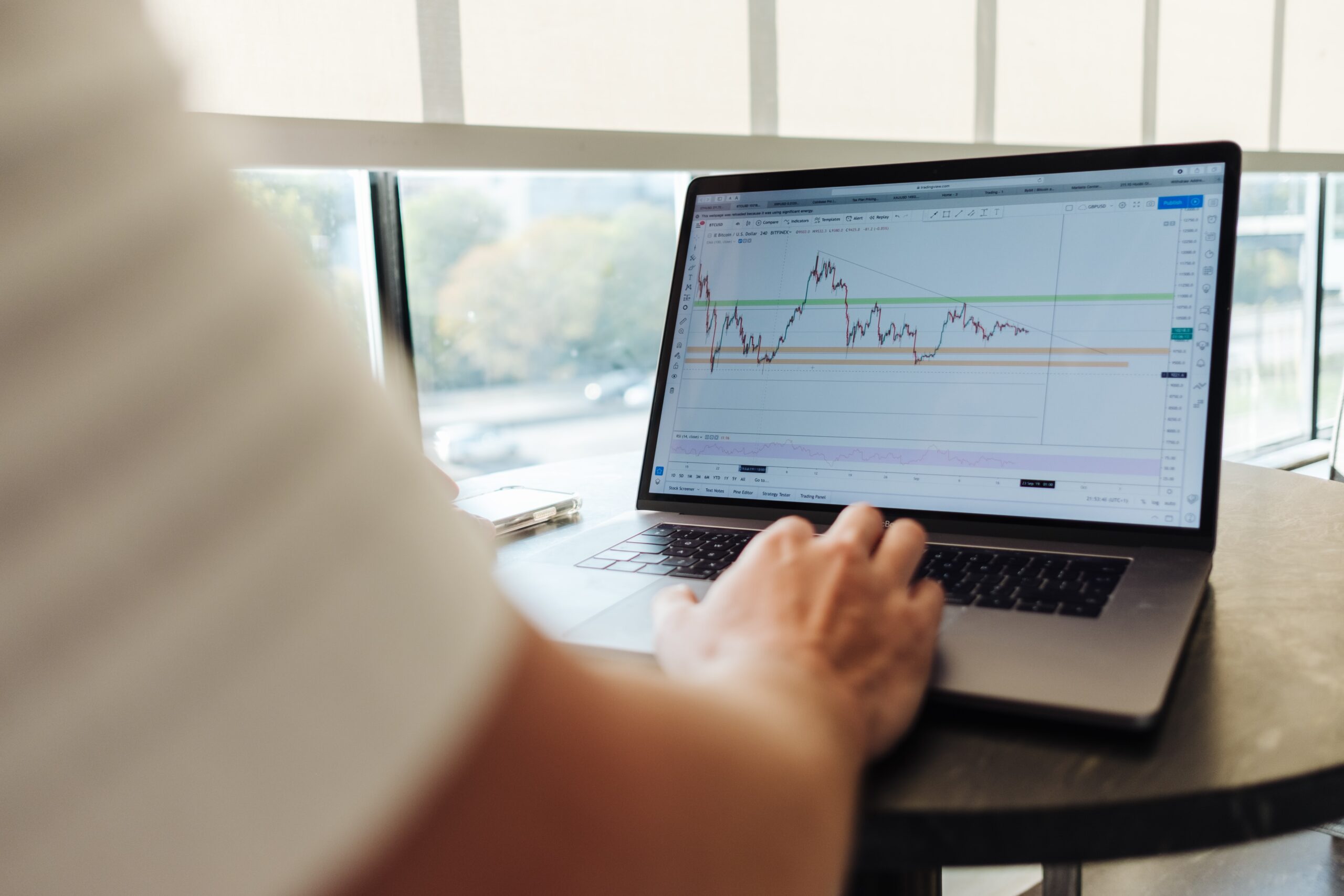 Investor looks at index fund and ETF data. Photo by Jason Briscoe on Unsplash