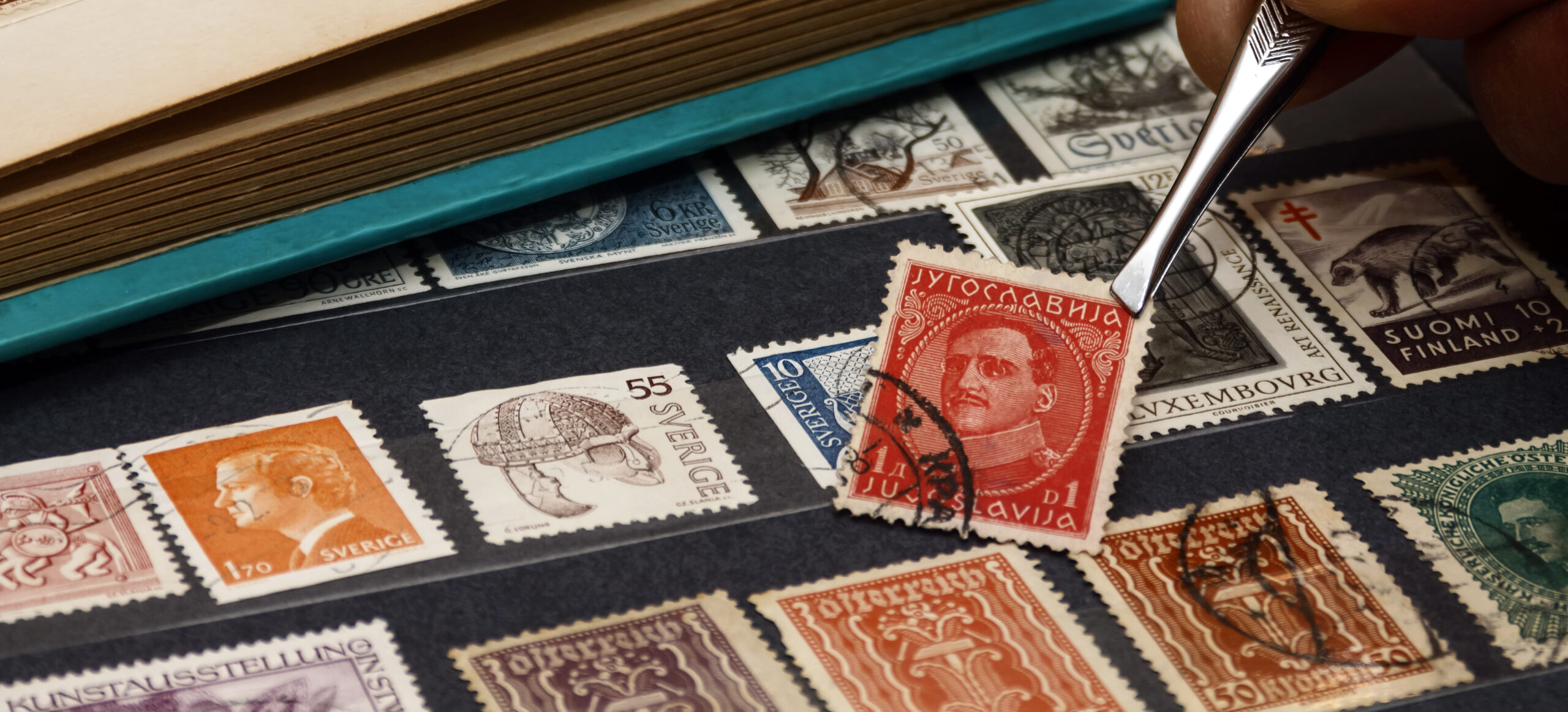 philatelist looks at postage stamps